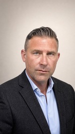 Kyle J.  Holland