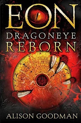 The cover of Eon. A red dragon's sharp talons grip a gold circle made of runes, with a red circle inside, resembling an eyeball. 