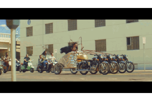 Eric Nally riding in an eagle head chariot drawn by four motorcycles. It's magnificent.