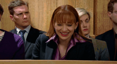 Jen from The IT Crowd laughing, then looking around, with the text, 