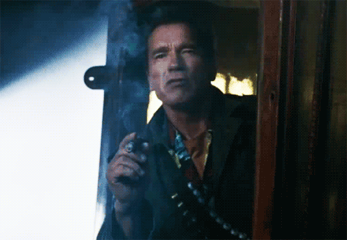 Arnold Schwarzenegger looking rough, smoking a cigar, and saying ‘I’m Back’