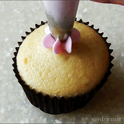 frosting a cupcake