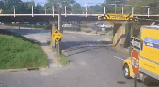 rental truck hitting bridge
