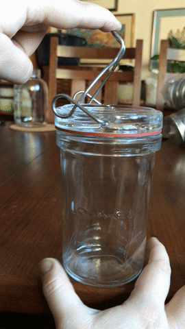 A GIF of how to securely close Lock Eat jars. 