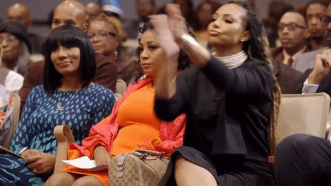 Tamar Braxton in church doing a soul clap.