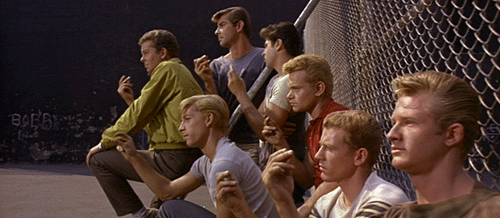 The Jets from West Side Story, looking tough and snapping their fingers.