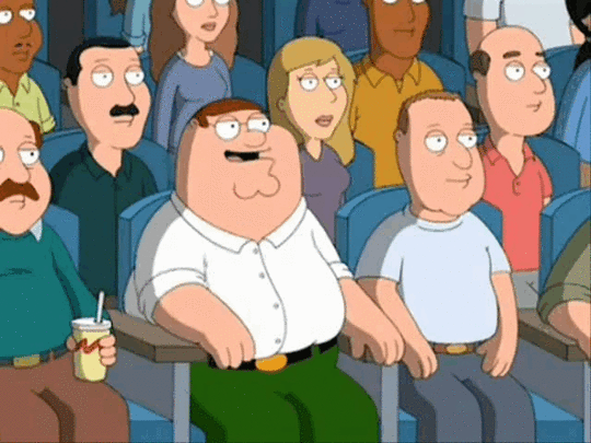 A scene from Family Guy in which Peter Griffin is in a movie theater. He points at the screen and says, 