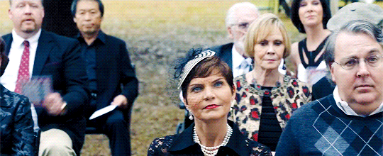 Get Out story structure Act Three. Members of the Coagula hold up bingo cards to bid on Chris' body