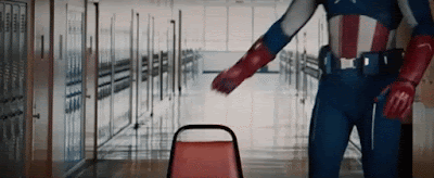 Captain America sitting down in a chair to have a serious chat gif