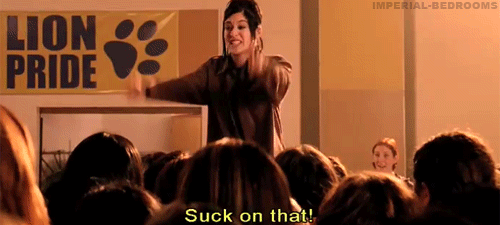 Janis Ian from mean girls, extending two middle fingers and yelling, 