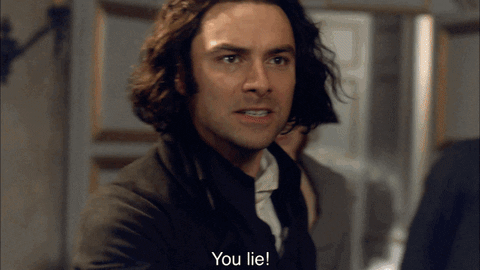 Aidan Turner as Ross Poldark, pointing furiously and shouting, 
