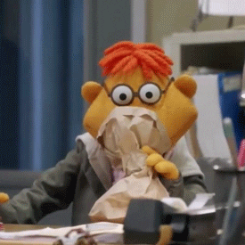 Scooter from The Muppet Show hyperventilating into a paper bag