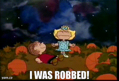 Sally from the Peanuts Halloween cartoon in a pumpkin field with Linus screaming