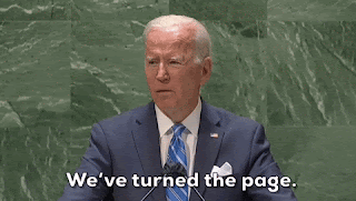 Joe Biden, talking to someone off camera, saying, 'We've turned the page.'