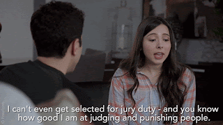 A young woman is talking to a man (we can only see his back.) Her caption says, 'I can't even get selected for jury duty - and you know how good I am at judging and punishing people.'