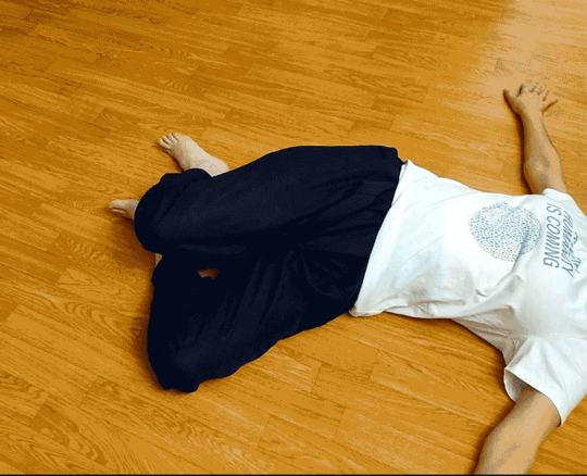 side to side with feet on the ground