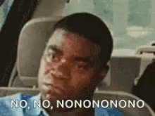 vehemently shaking head