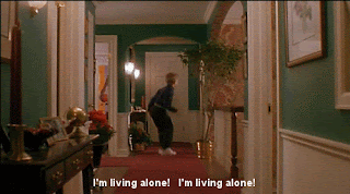 Taken from Home Alone, Kevin, a blonde haired, caucasion eight year old boy, is jumping up and down in his house, clearly excited. The caption says, 'I'm living alone, I'm living alone!