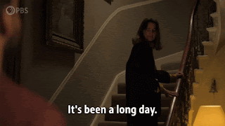 A woman in wearily climbing the stairs. She looks back to say something to someone off camera, standing at the bottom. The caption reads, 'I'm running a bath. It's been a long day.'