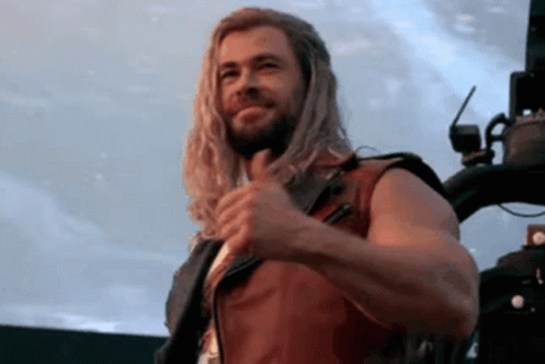 Thor giving a thumbs-up and smiling. (Played by Chris Hemsworth in the movie Love and Thunder.)