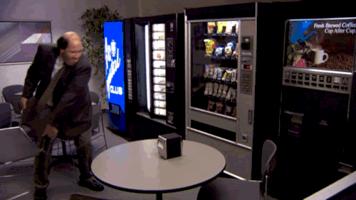 breaking vending machine to grab all da snacks