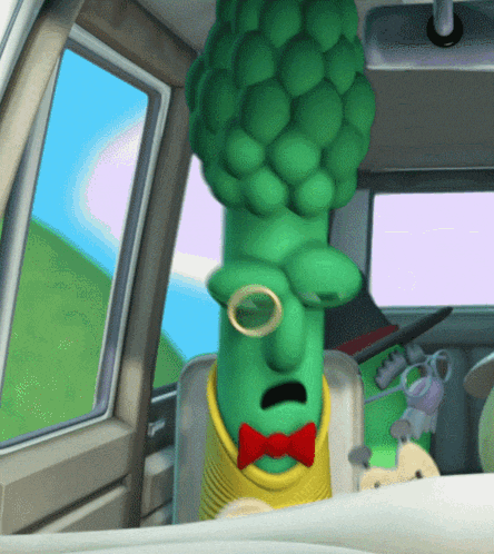 Archibald Asparagus holding a guitar and face-desking in a car from the Silly Song 'The Biscuit of Zazzamarandabo