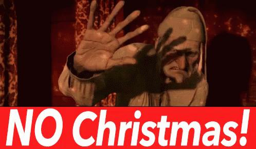 A character in a hooded cloak with a distressed expression, appearing to reject the idea of Christmas, with bold text overlay saying 'NO Christmas!'