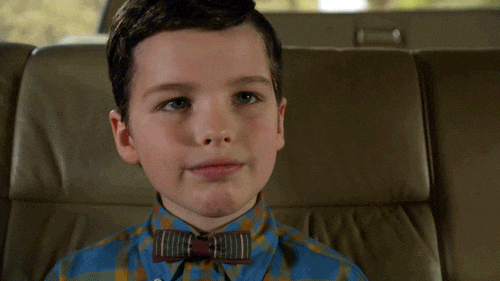Young Sheldon adjusts his bowtie
