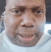 TikTok user OKZ14 staring into the camera with tears in his eyes and then suddenly bursting out crying