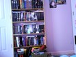 Messy bookshelf >.<