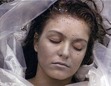 "She's dead. Wrapped in plastic"