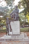 This is the largest statue of Dickens in the world. He is here with Little Nell looking up at him. It is sitting in Clark Park, in West Philadelphia. 