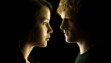 The movie posters of Katniss and Peeta, which are hanging on my bedroom wall.