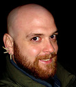 Brent Michael Kelley lives in the countryside north of Tomahawk, Wisconsin, with his wife Keri, their son Jordy, and a small zoo of strange animals. He assures you he is not building an army of clone-bots at a secret bunker in the forest. His rivals may insist otherwise, but they are all madmen, bent on world domination. Not Brent, though. Nope.
In addition to short stories, he writes about his pal Chuggie, the drunken and travel-worn embodiment of drought. Chuggie and the Desecration of Stagwater is available now, and the next Chuggie adventure is coming soon.