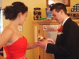 Nathan successfully places the flower on Emili's wrist on the first try.