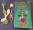 I do NOT recommend this particular edition (Archway Paperback, published by Pocket Books, 1978 edition) - it has typos, and the girl on the cover does not resemble Lorrie at all (wrong coloured hair, for starters).
Anyway, the stork-shaped scissors are the key gift here, and with some embroidery floss (PLUS golden-plated embroidery or cross-stitch needles, PLUS a vintage wooden needle case, if you really want to go all out!)