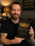 Author Holding Book