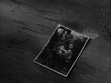 T.