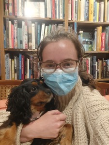 Jo reads while Ruby snuggles 