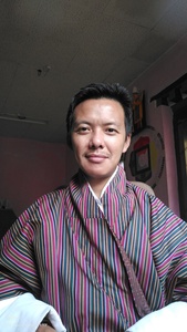 Nima Wangdi  Reading toddler 